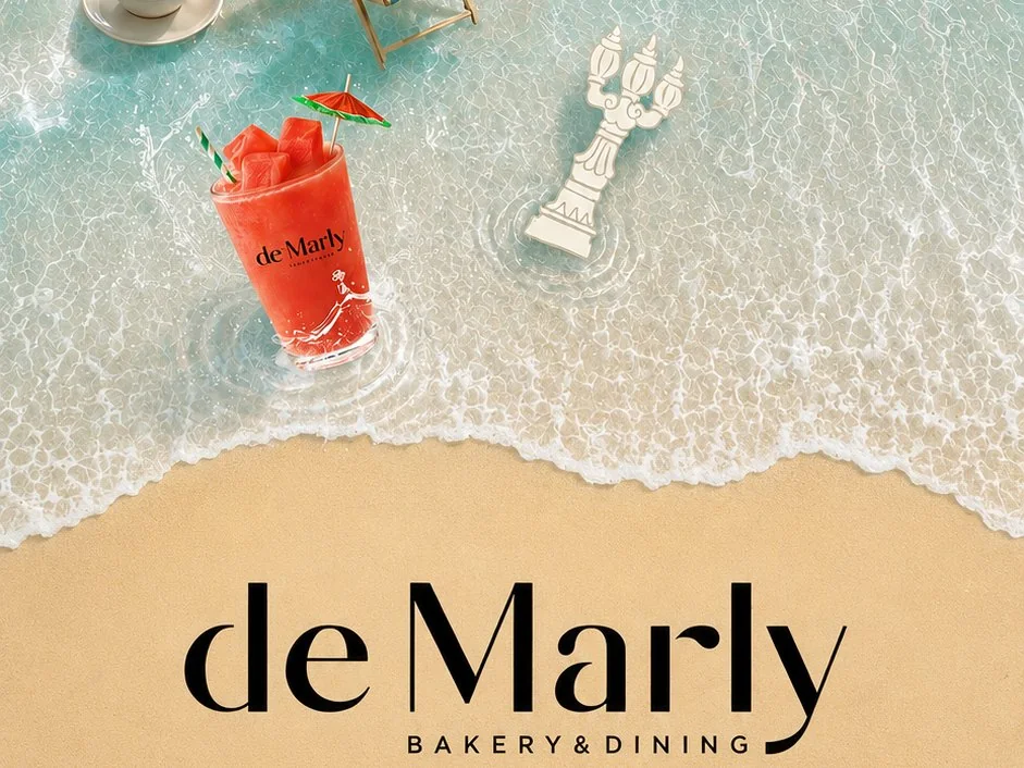 de Marly summer ad: a watermelon drink in the surf above the de Marly logo